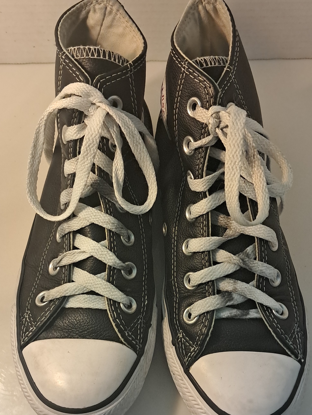 Converse  Unisex High-Top Leather Sneakers in Black and White